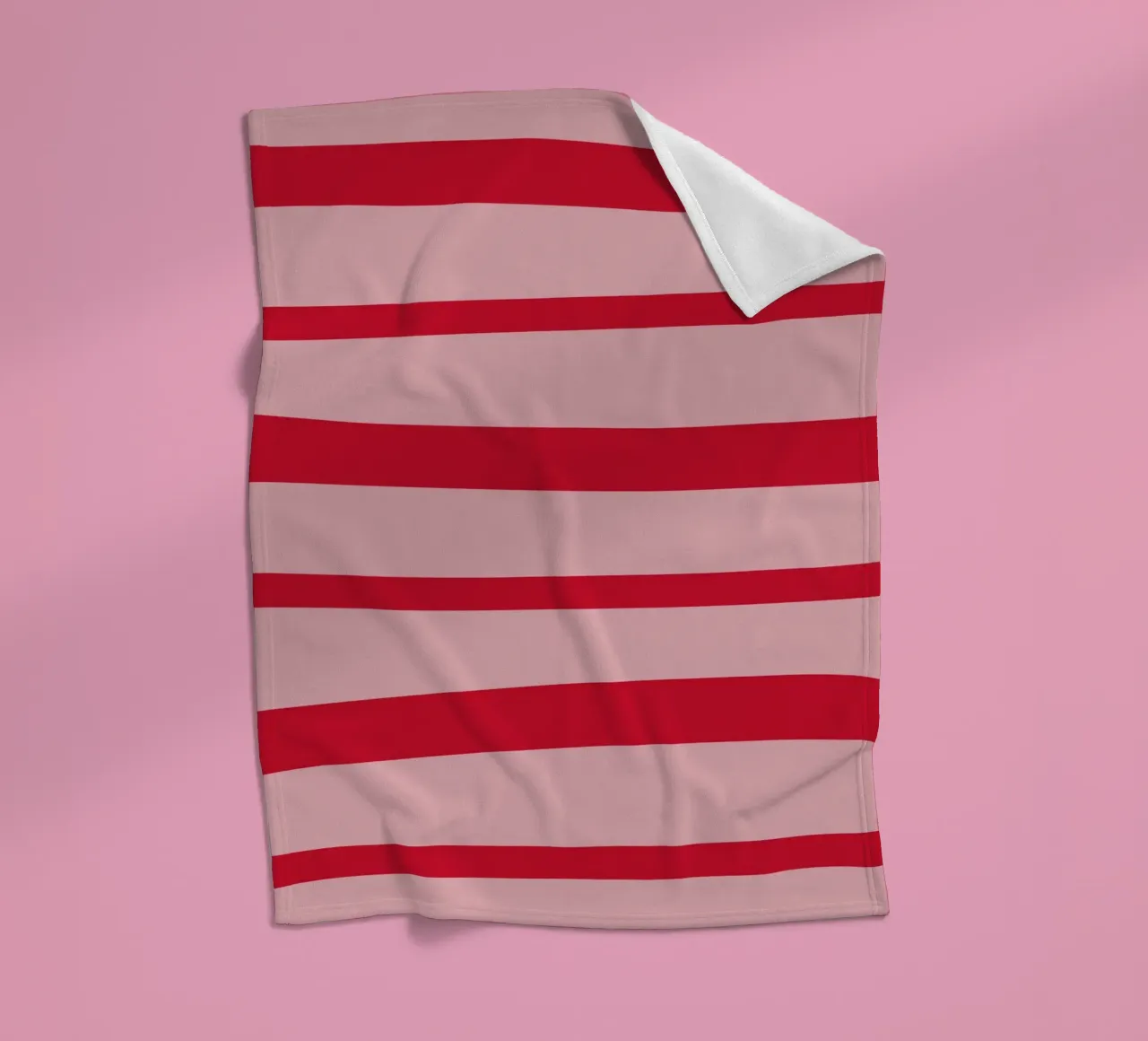 Diagonal hand-painted lines in strawberry red on pink fleece blanket by Stilrausch