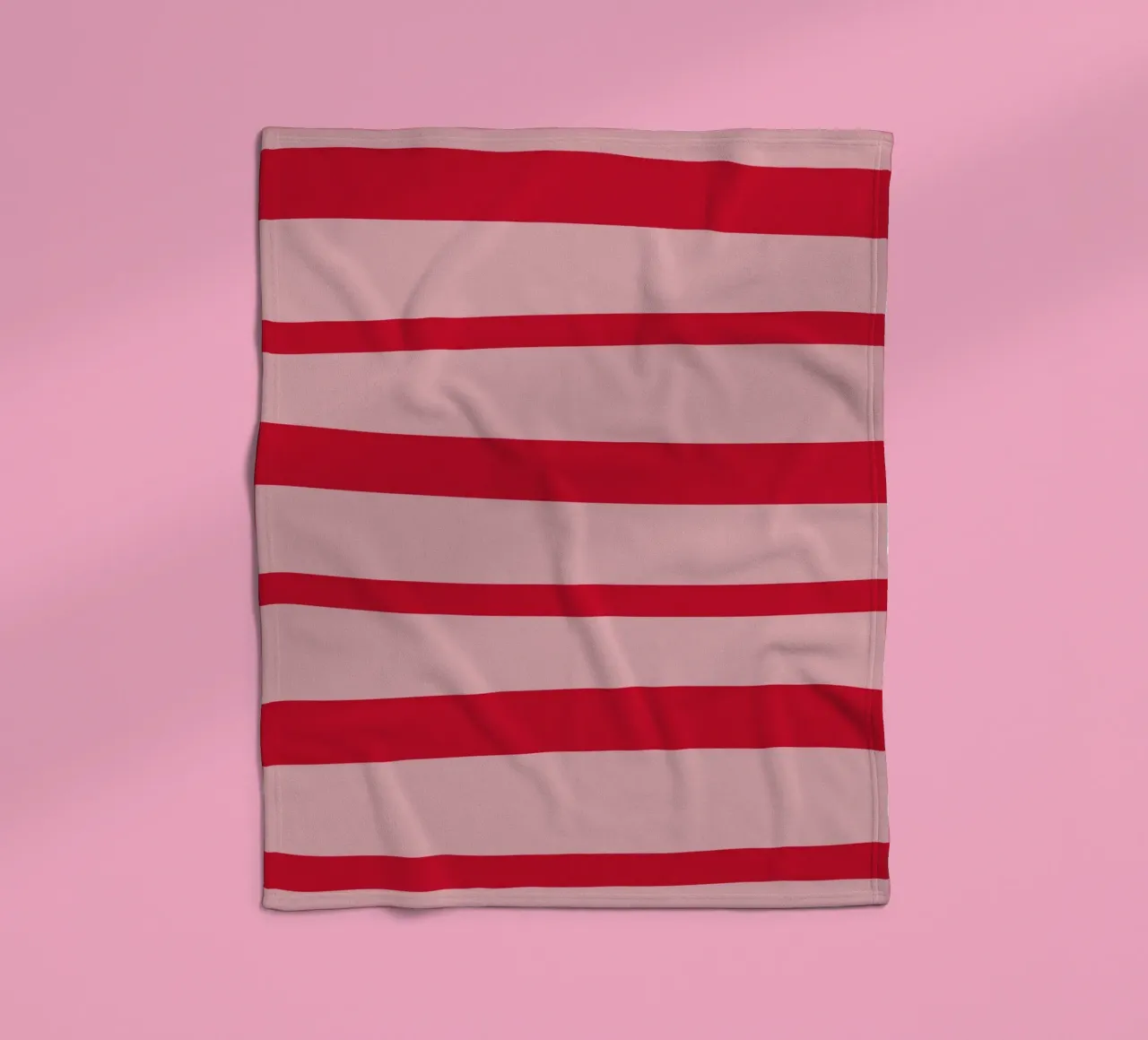 Diagonal hand-painted lines in strawberry red on pink fleece blanket by Stilrausch