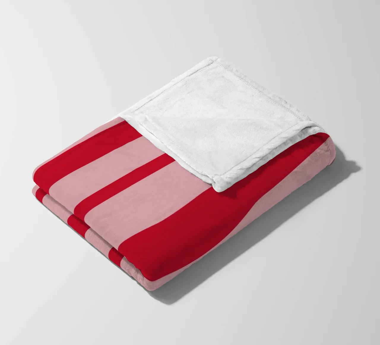 Diagonal hand-painted lines in strawberry red on pink fleece blanket by Stilrausch
