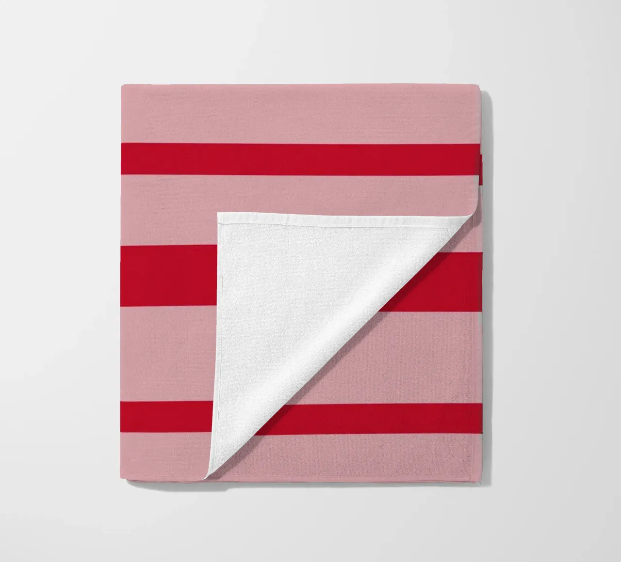 Horizontal hand-painted lines in strawberry red on pink beach towel by Stilrausch