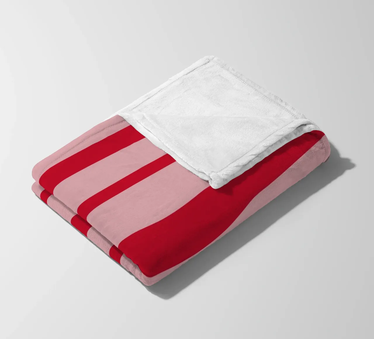 Horizontal hand-painted lines in strawberry red on pink fleece blanket by Stilrausch