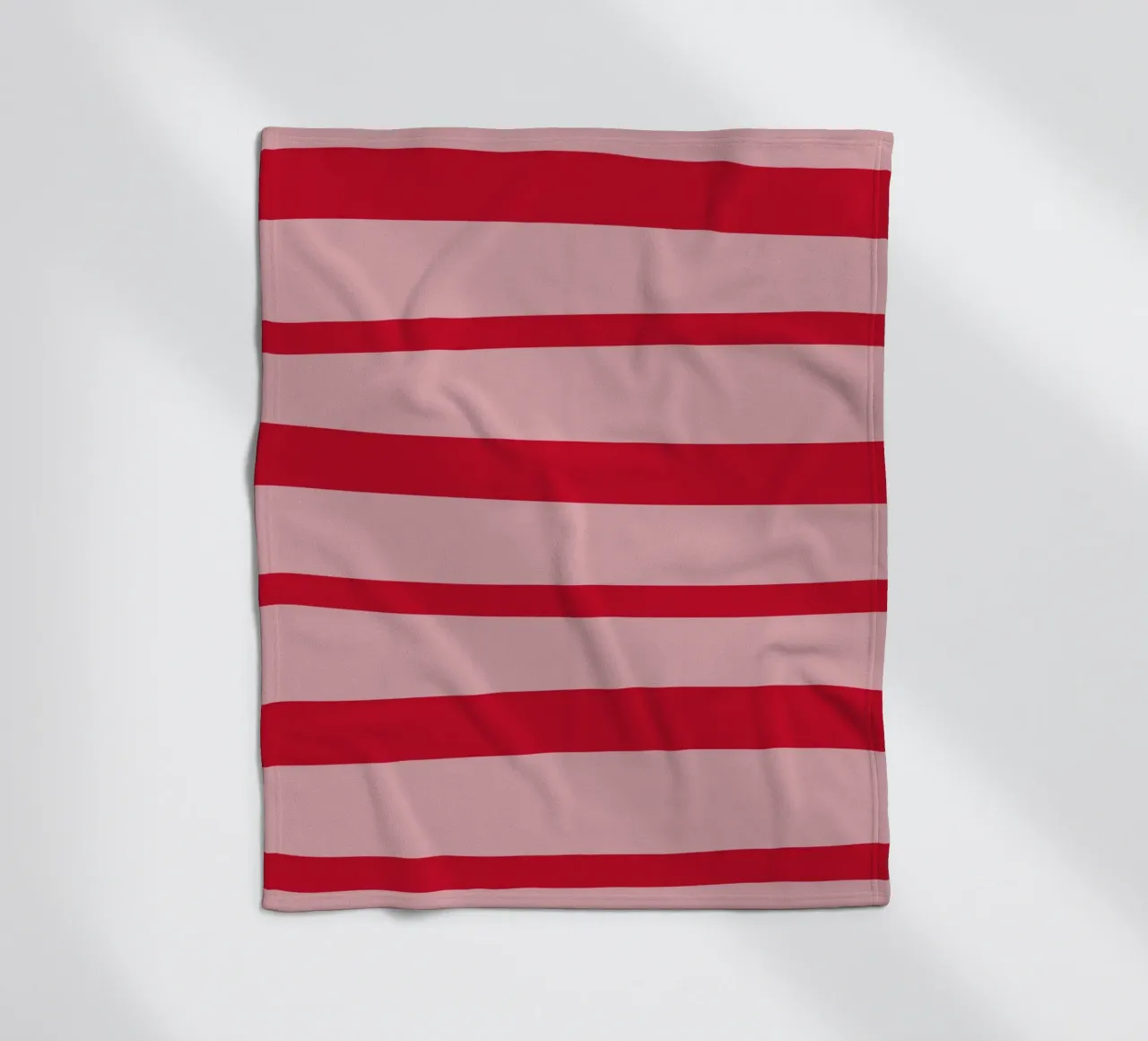 Horizontal hand-painted lines in strawberry red on pink fleece blanket by Stilrausch