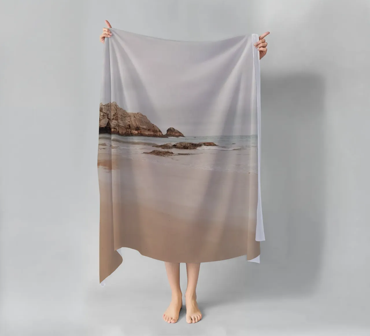 Misty Coastal Beach with Rocks - Serene Seascape Art beach towel by ClubArt