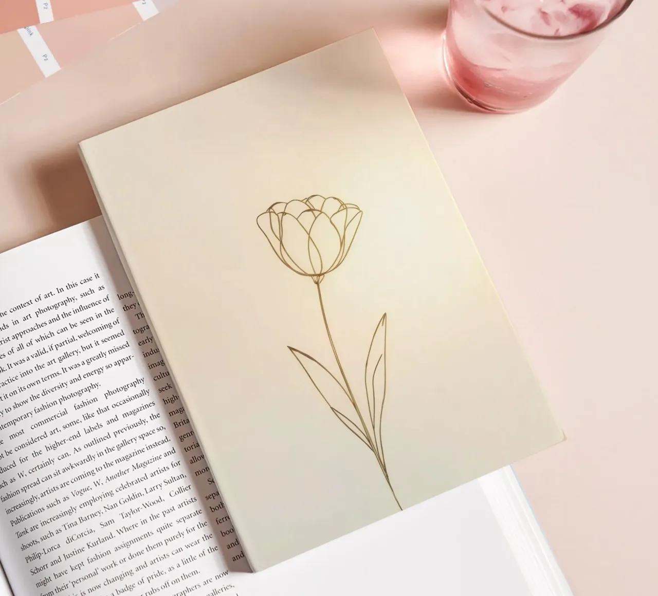 Elegant line drawing of a flower against a soft background notebook by DesignDoodle