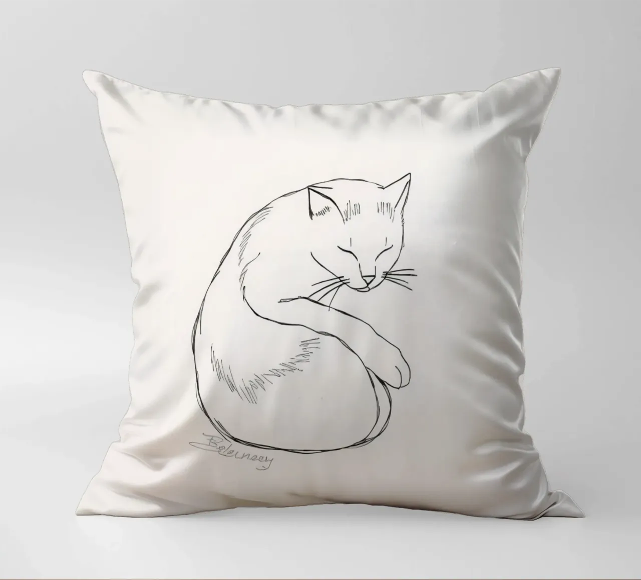 Line drawing of a resting cat with a minimalist design decorative cushion by DesignDoodle