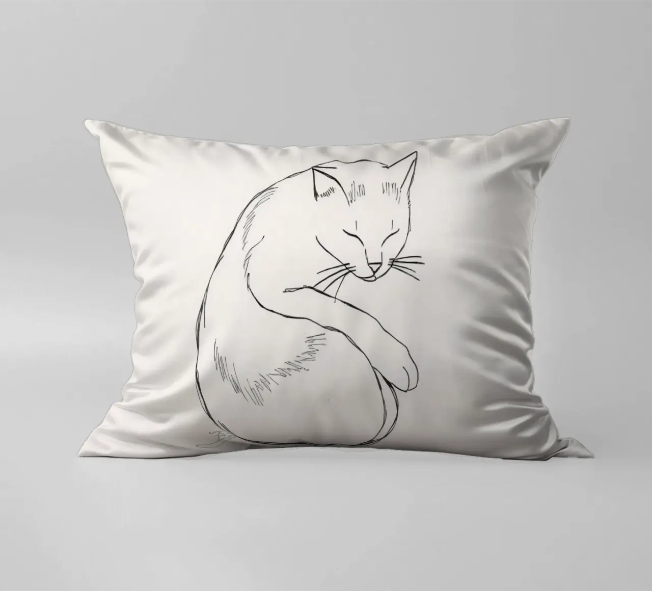 Line drawing of a resting cat with a minimalist design decorative cushion by DesignDoodle