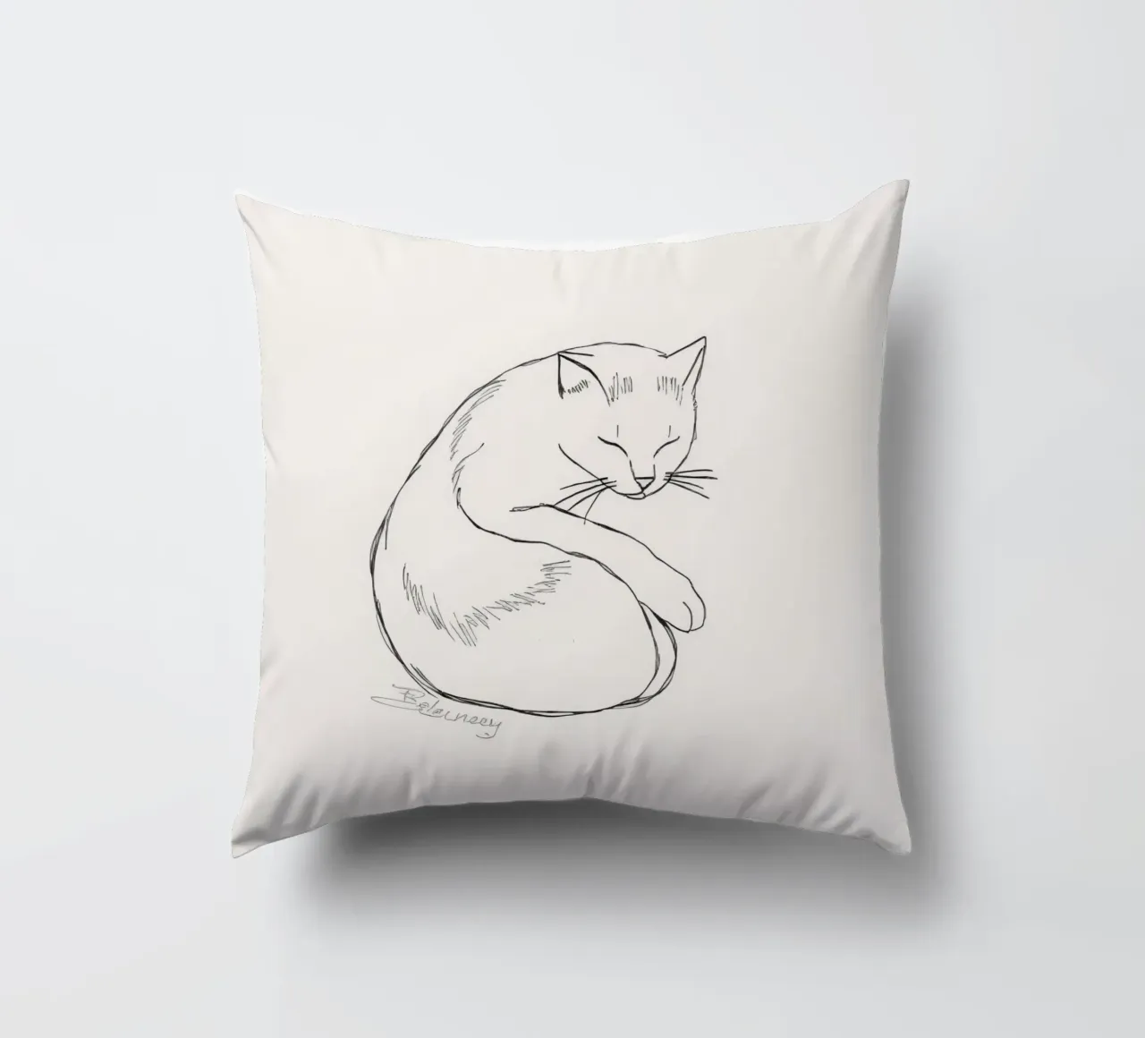 Line drawing of a resting cat with a minimalist design decorative cushion by DesignDoodle