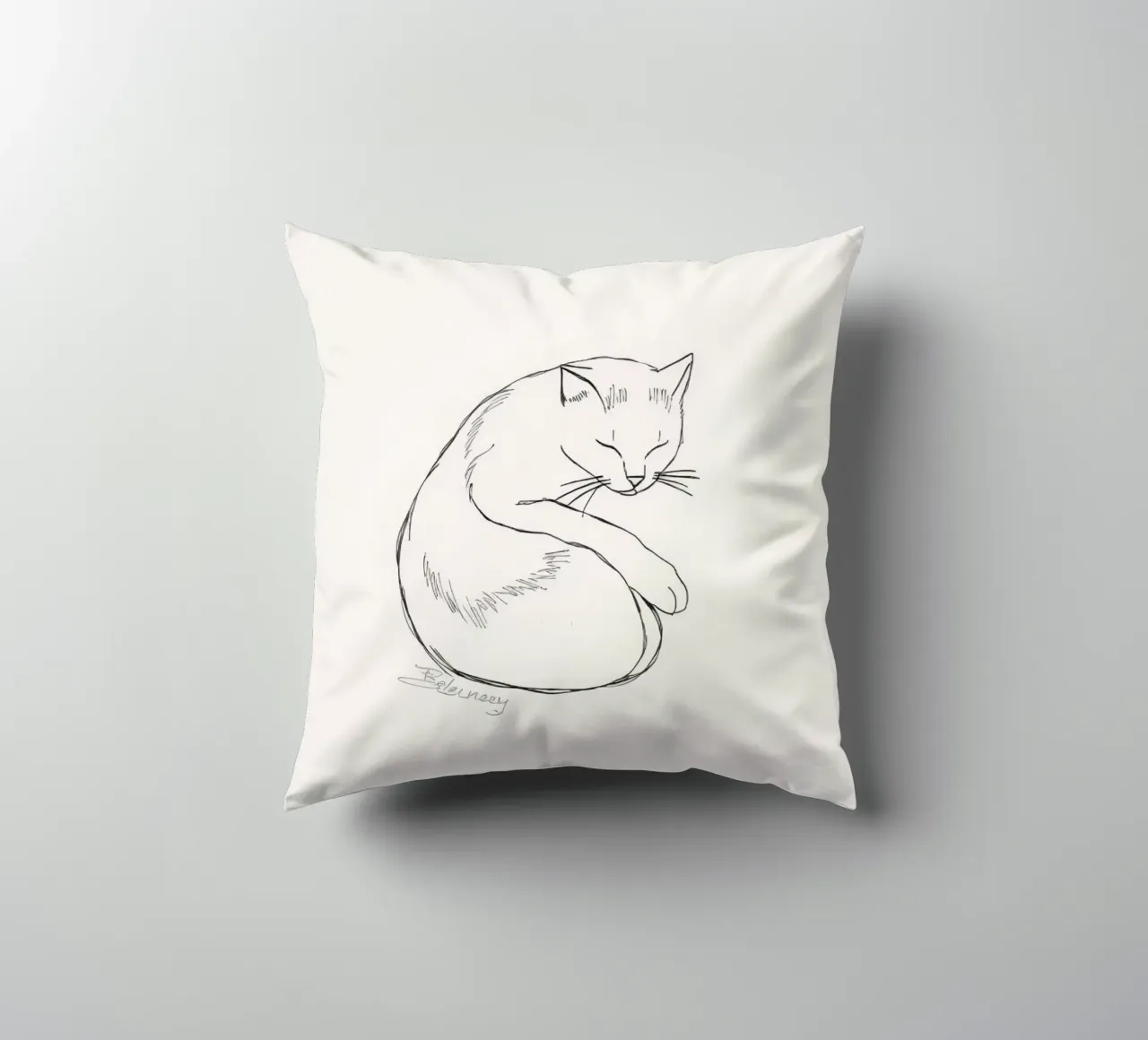 Line drawing of a resting cat with a minimalist design decorative cushion by DesignDoodle