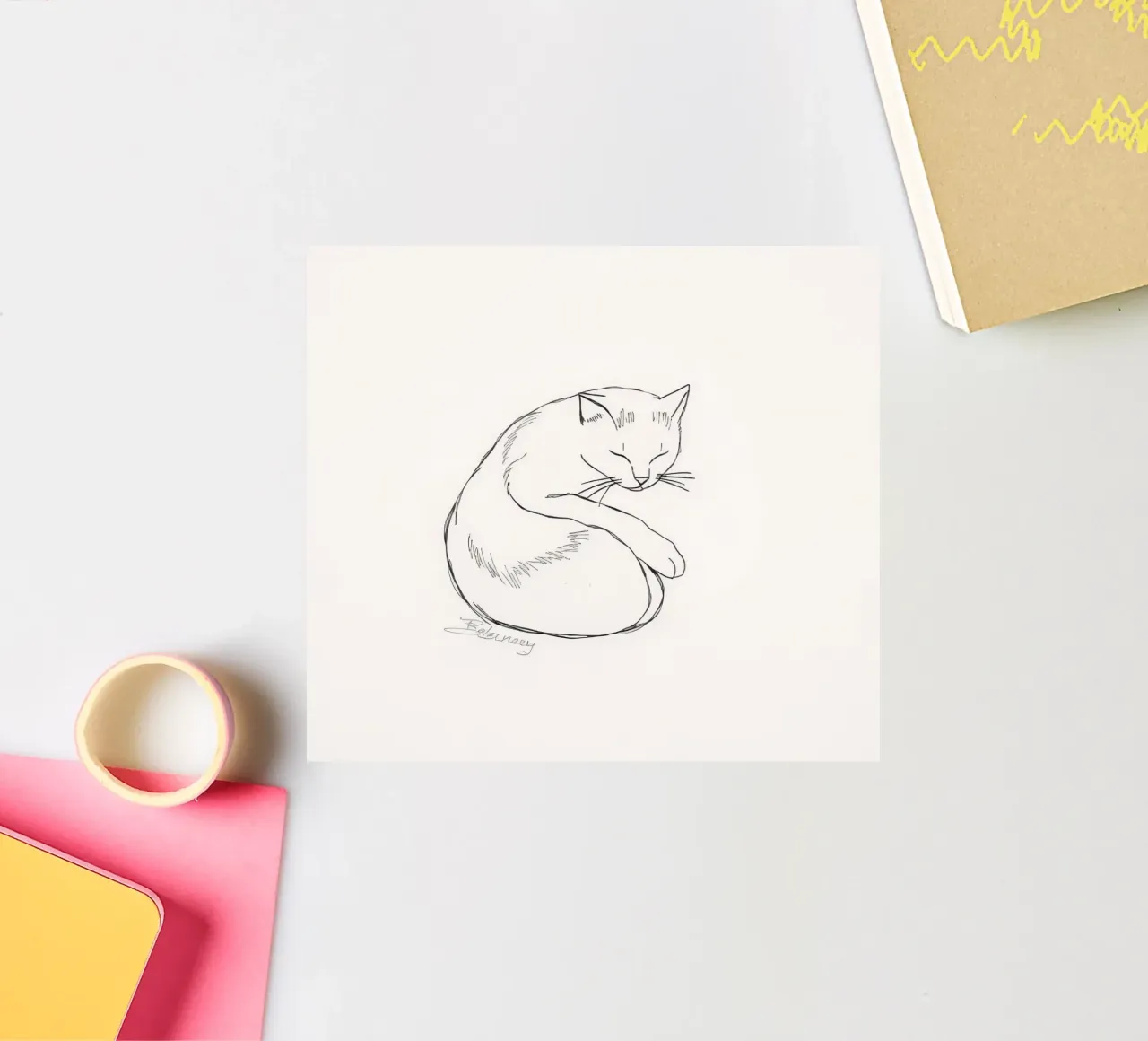 Line drawing of a resting cat with a minimalist design sticker by DesignDoodle