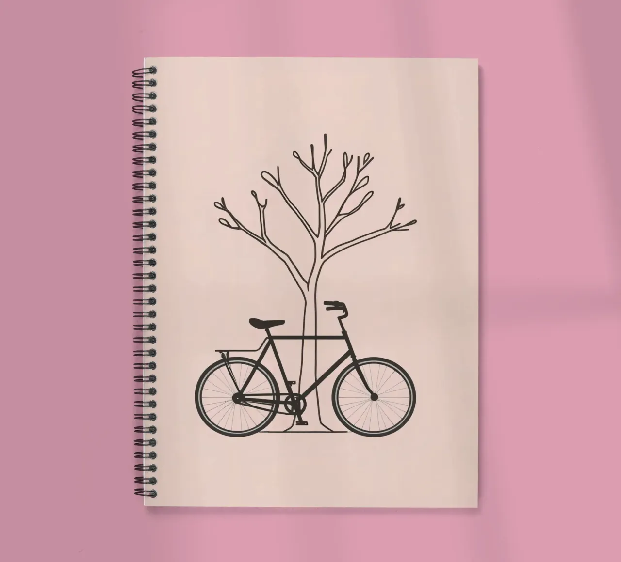 Bicycle leaning against a bare tree on a muted background spiral notebook by DesignDoodle