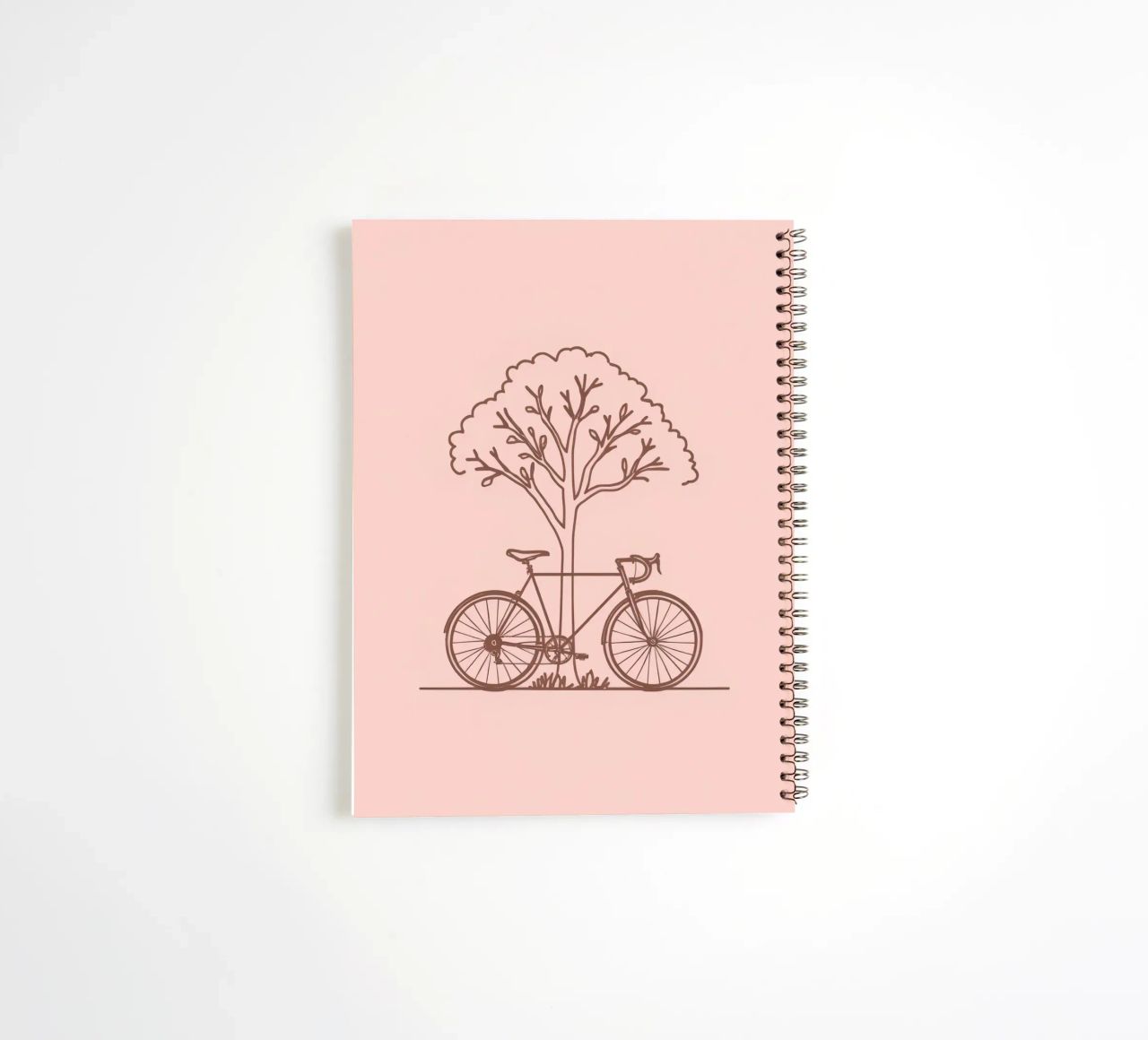 Bicycle leaning against a tree in a park with simple design spiral notebook by DesignDoodle