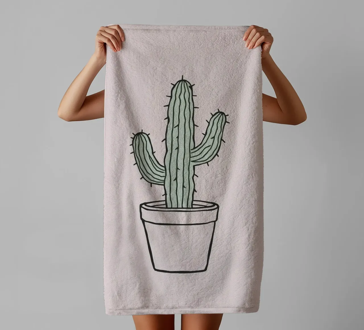 Cactus in a minimalist pot against a soft pink background towel by DesignDoodle