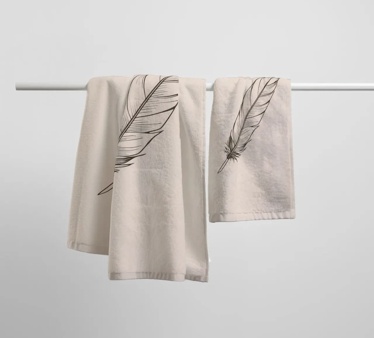 Delicate black feather resting on a light background towel by DesignDoodle