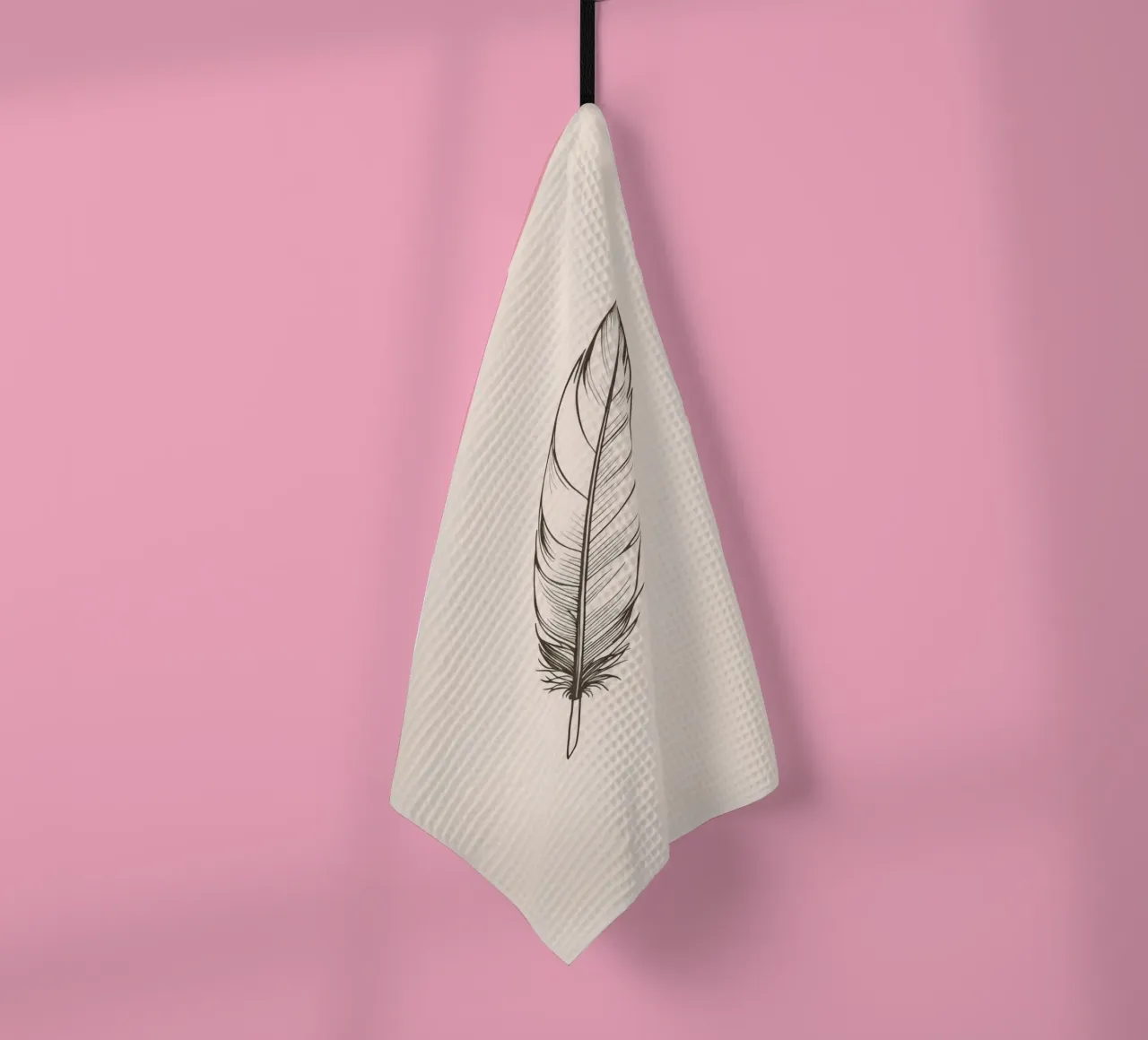Delicate black feather resting on a light background tea towel by DesignDoodle