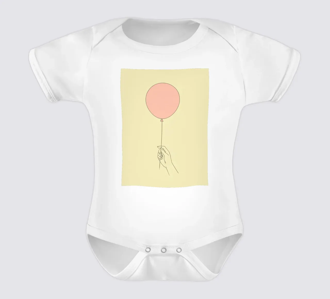 Mano che tiene un palloncino rosa su un'opera d'arte giallo tenue body neonato maniche corte da DesignDoodle