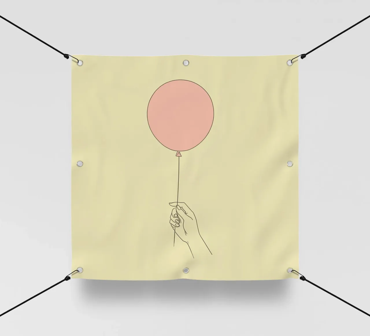 Mano che tiene un palloncino rosa su un'opera d'arte giallo tenue telo in pvc da DesignDoodle