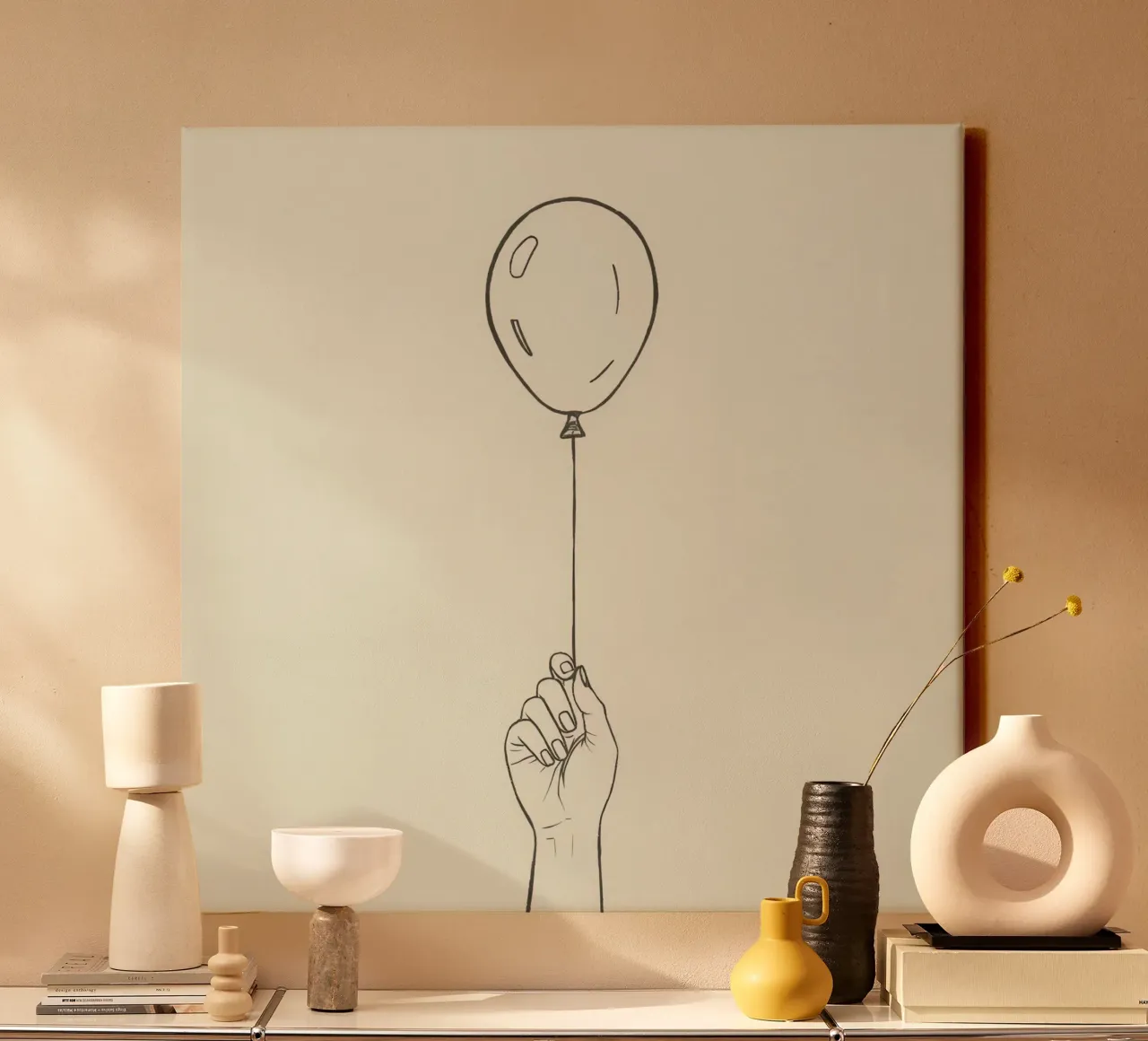 Hand holding a balloon in a minimalistic artistic style canvas by DesignDoodle