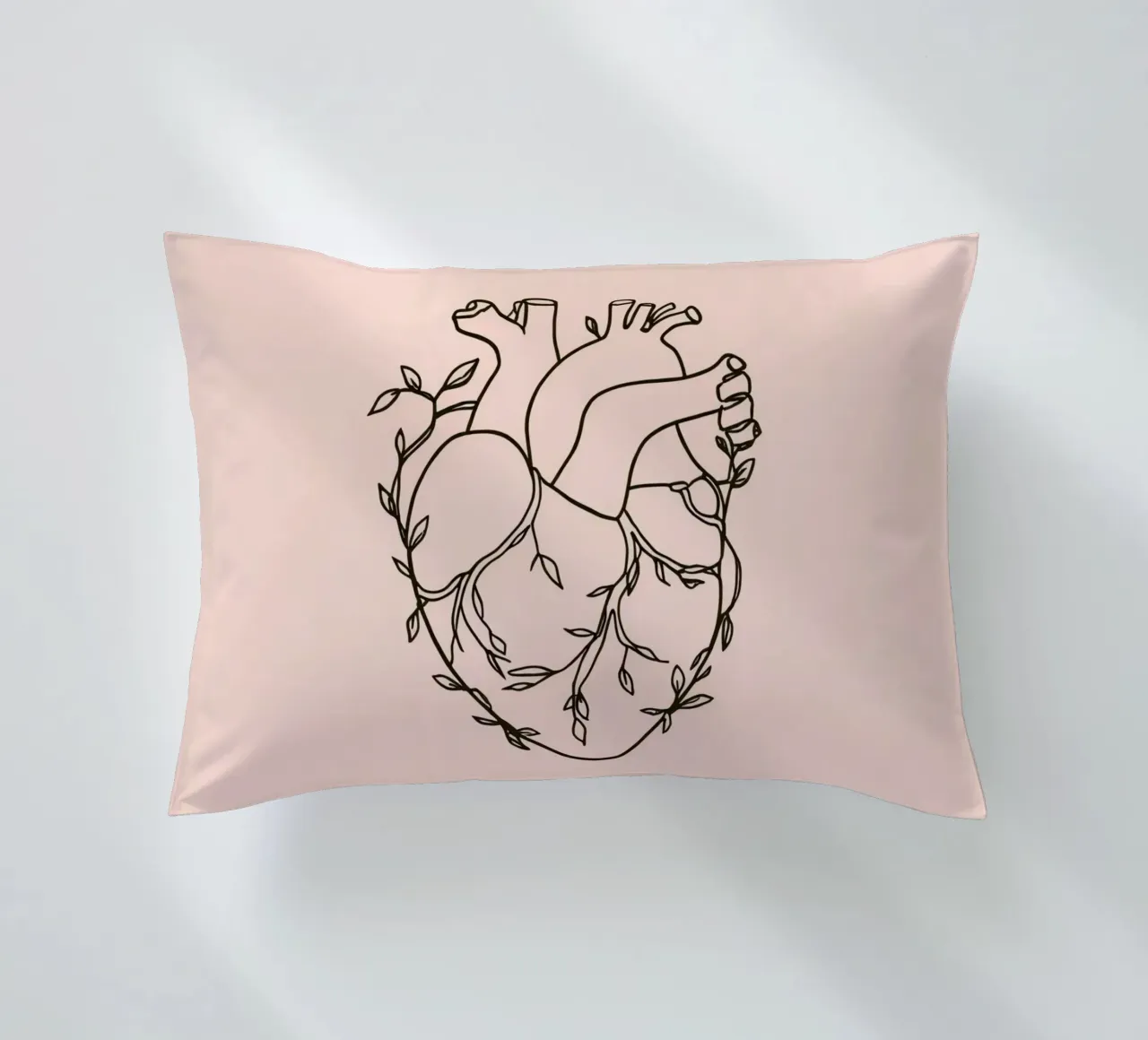 Artistic representation of a heart intertwined with plants decorative cushion by DesignDoodle