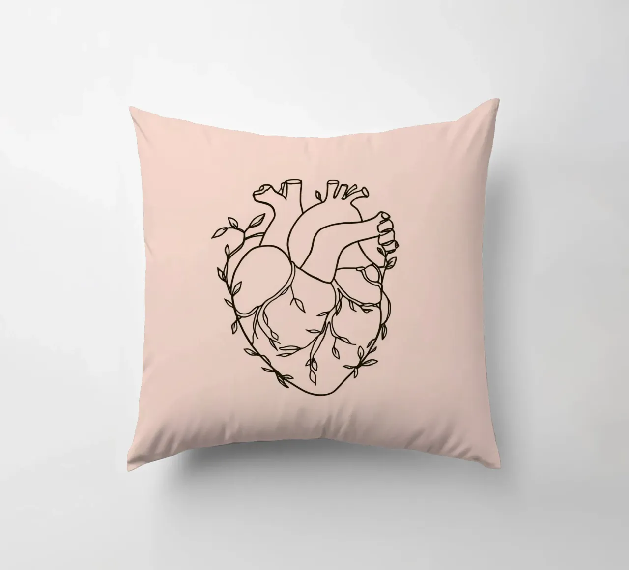 Artistic representation of a heart intertwined with plants decorative cushion by DesignDoodle