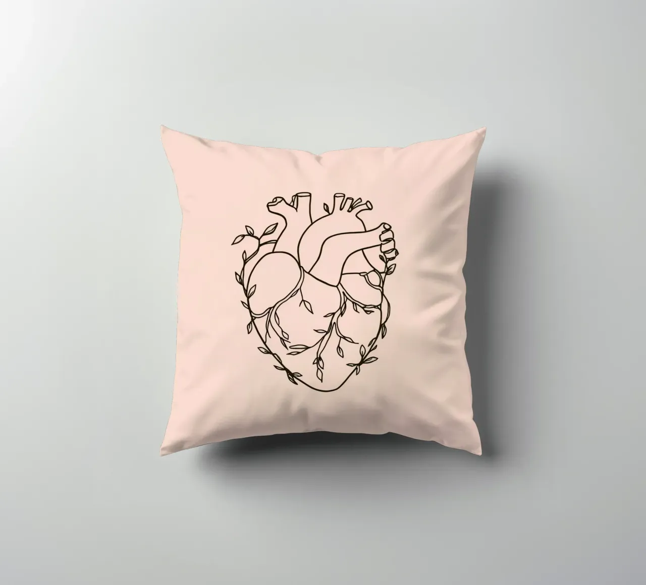 Artistic representation of a heart intertwined with plants decorative cushion by DesignDoodle