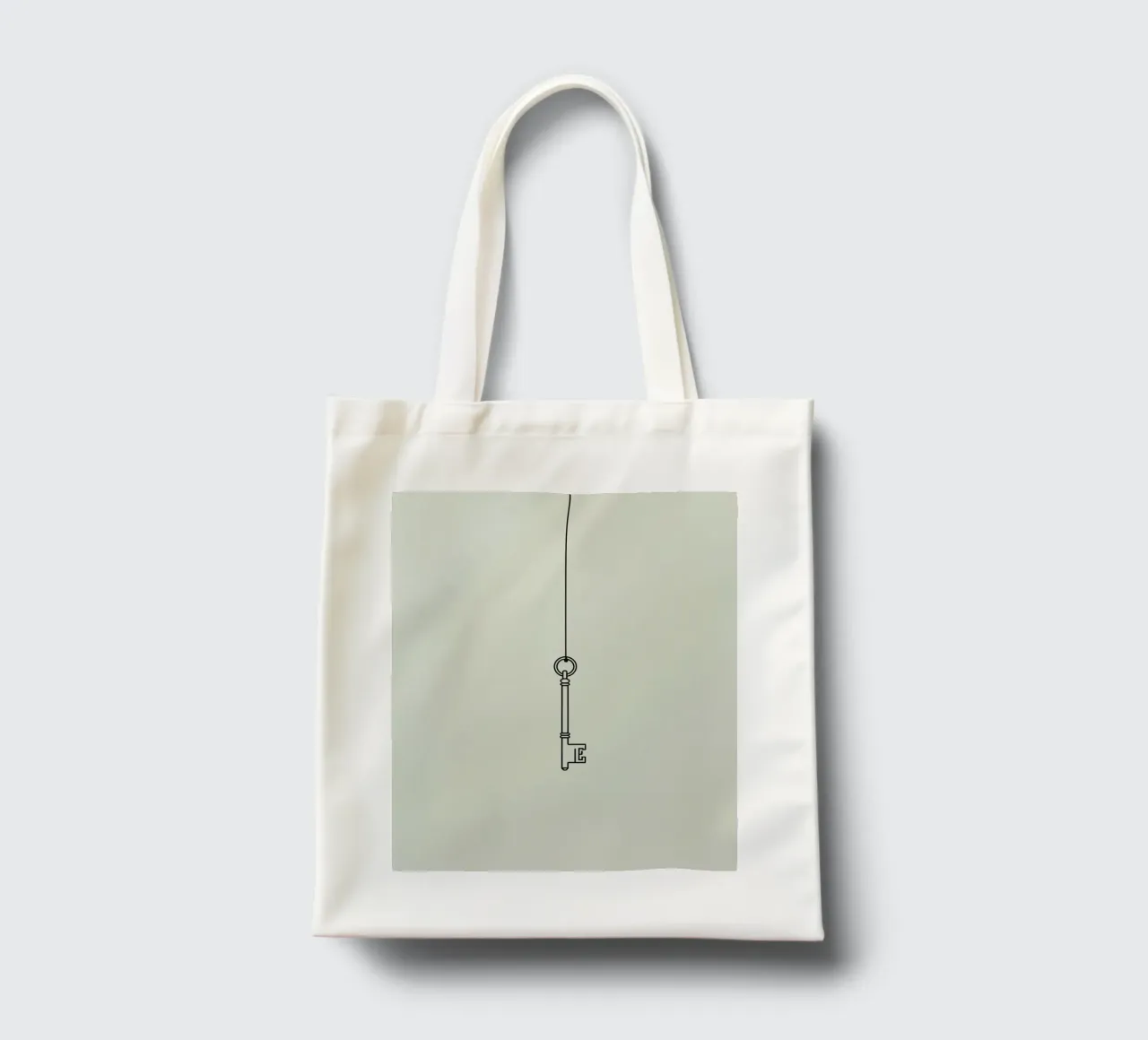 Chiave appesa a un filo su uno sfondo chiaro borsa in juta da DesignDoodle