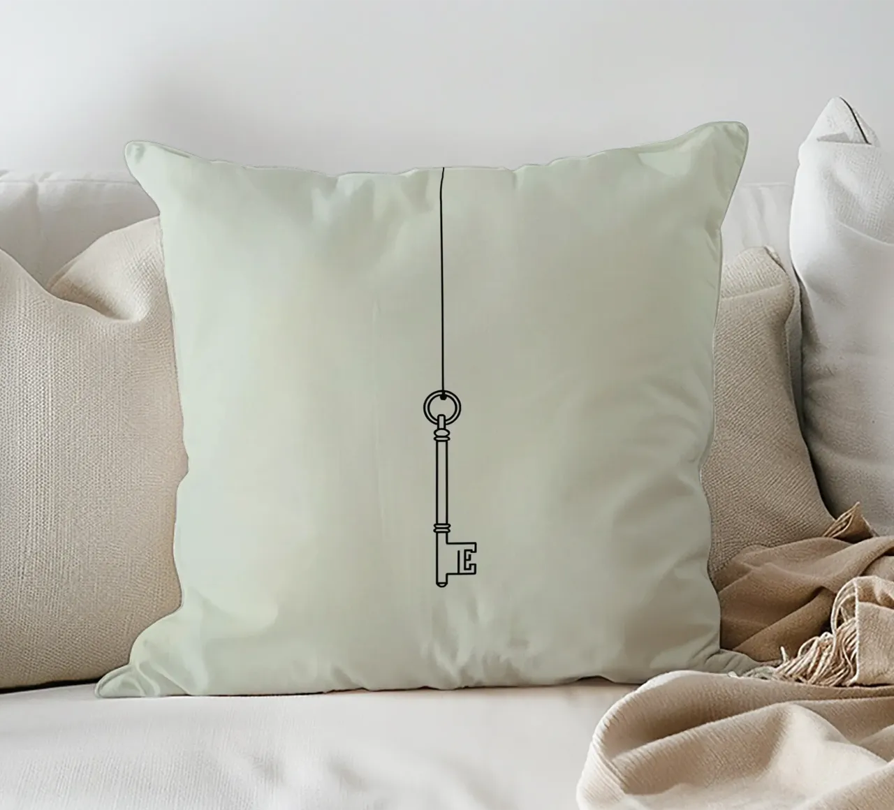 Key hanging from a string against a light backdrop decorative cushion by DesignDoodle