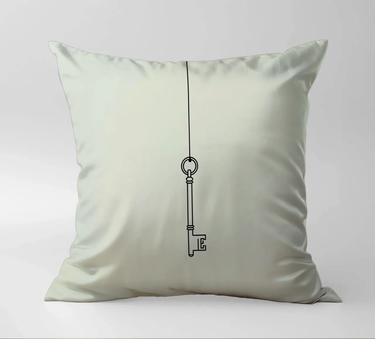 Key hanging from a string against a light backdrop decorative cushion by DesignDoodle