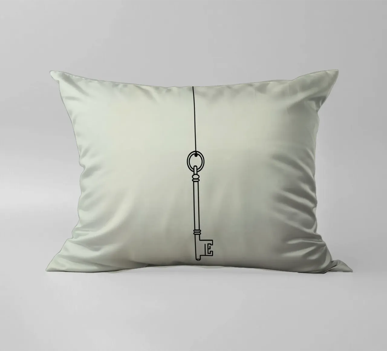 Key hanging from a string against a light backdrop decorative cushion by DesignDoodle
