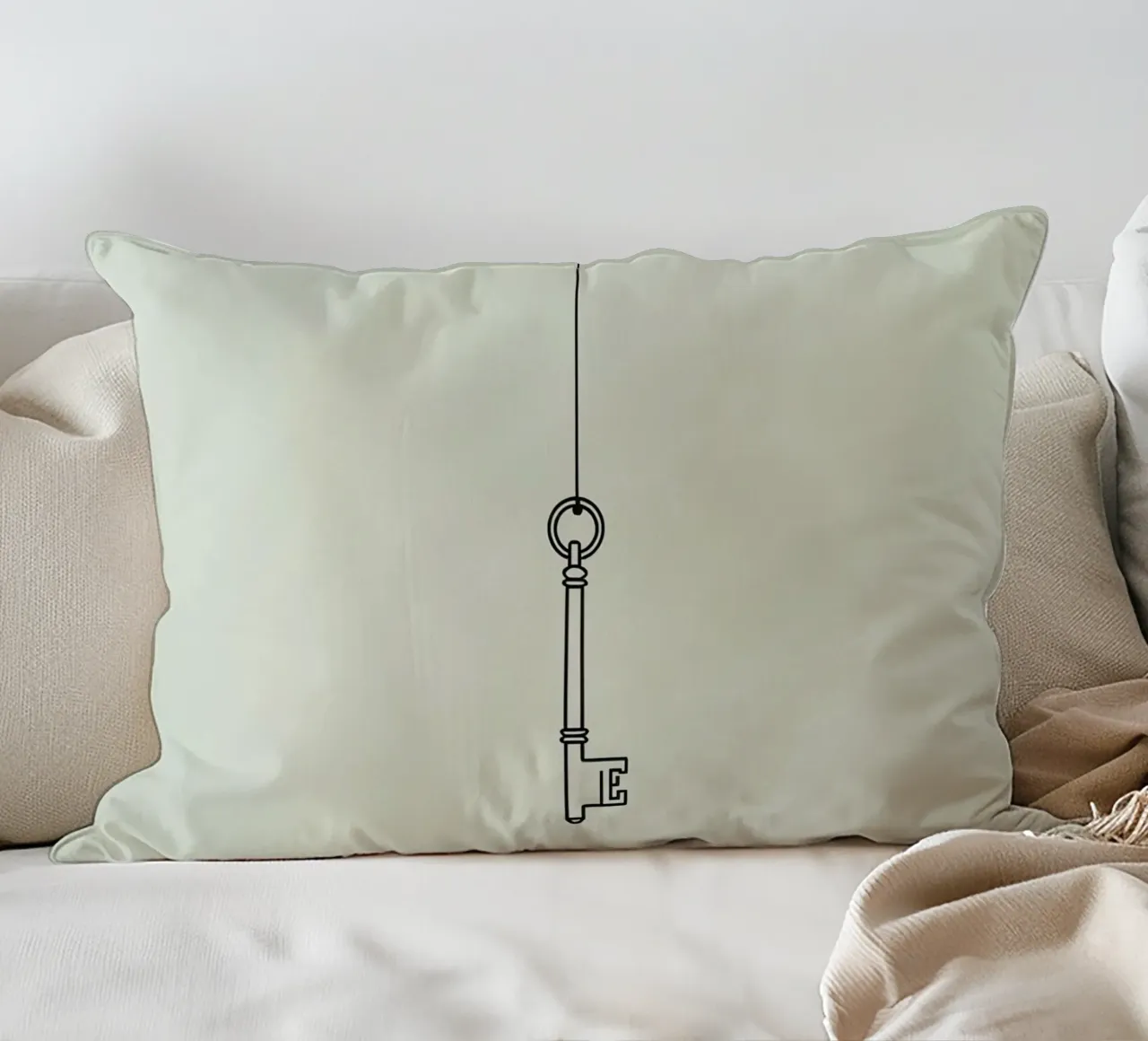 Key hanging from a string against a light backdrop decorative cushion by DesignDoodle