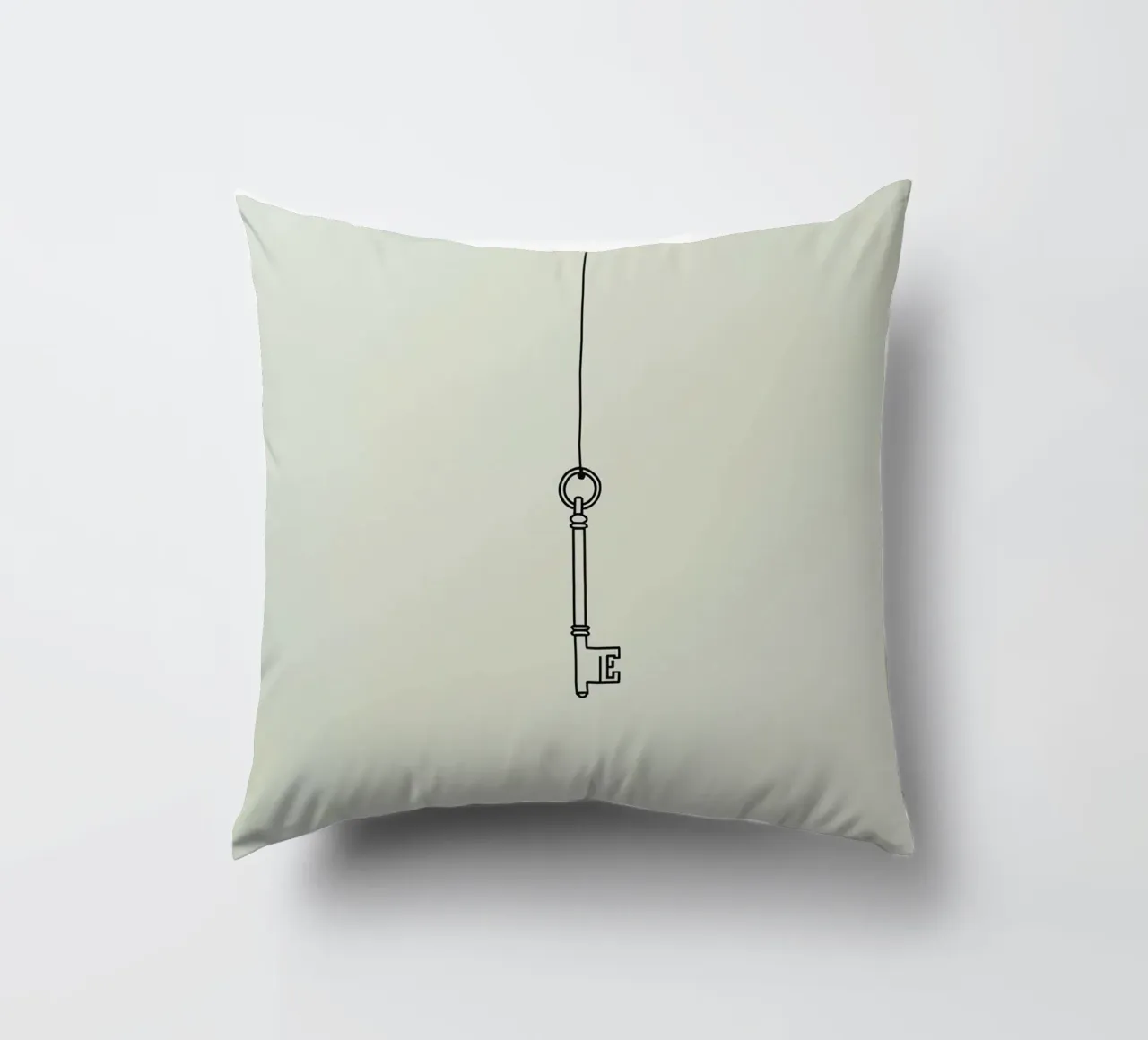 Key hanging from a string against a light backdrop decorative cushion by DesignDoodle