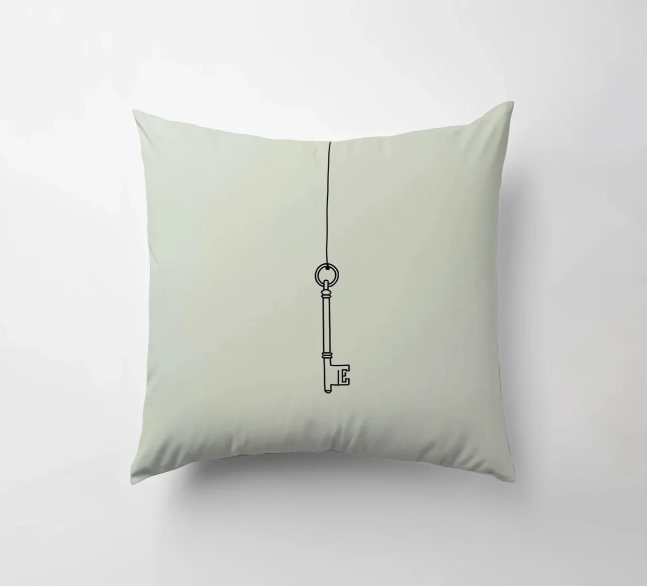 Key hanging from a string against a light backdrop decorative cushion by DesignDoodle