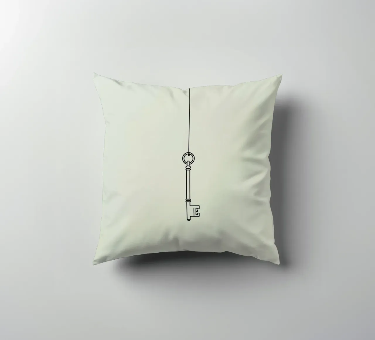 Key hanging from a string against a light backdrop decorative cushion by DesignDoodle