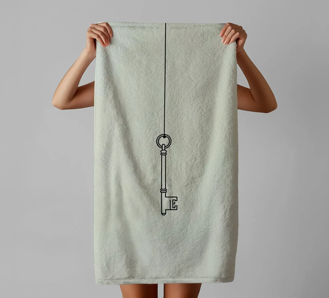 Schlüssel an einer Schnur hängend vor einem Lichthintergrund Handtuch von DesignDoodle