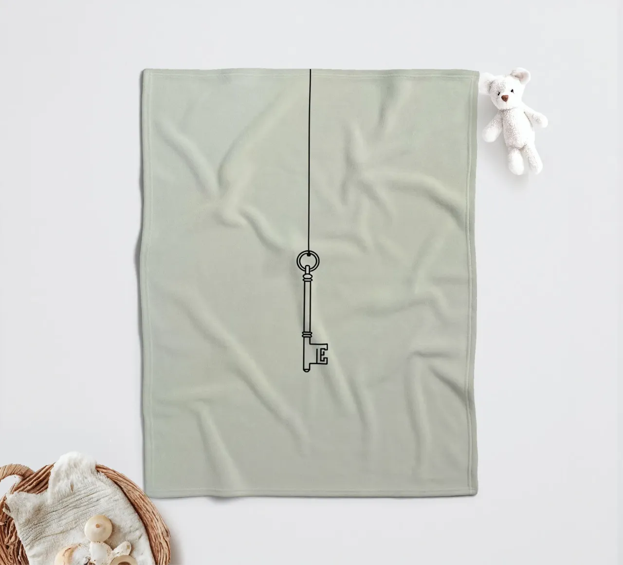 Key hanging from a string against a light backdrop fleece blanket by DesignDoodle