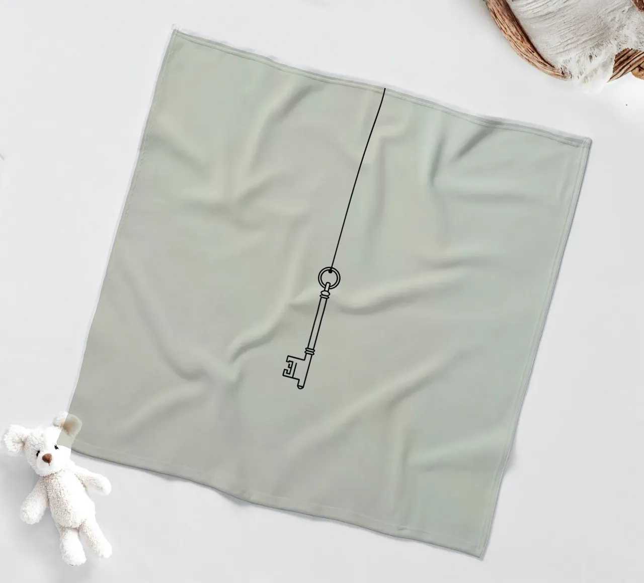 Key hanging from a string against a light backdrop fleece blanket by DesignDoodle