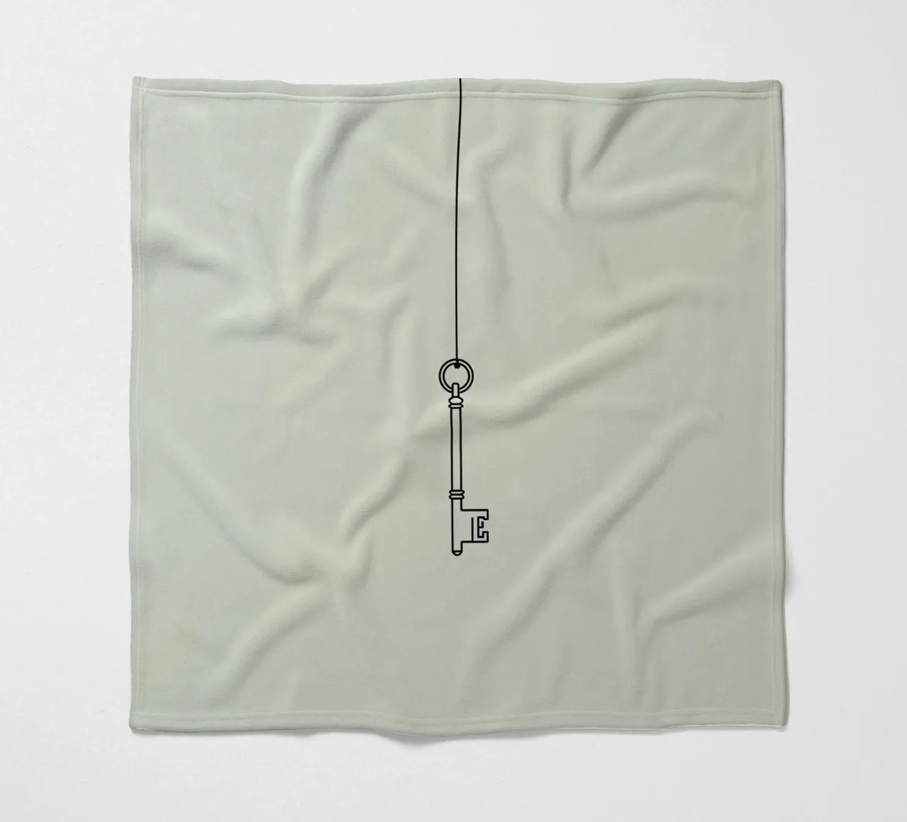 Key hanging from a string against a light backdrop fleece blanket by DesignDoodle