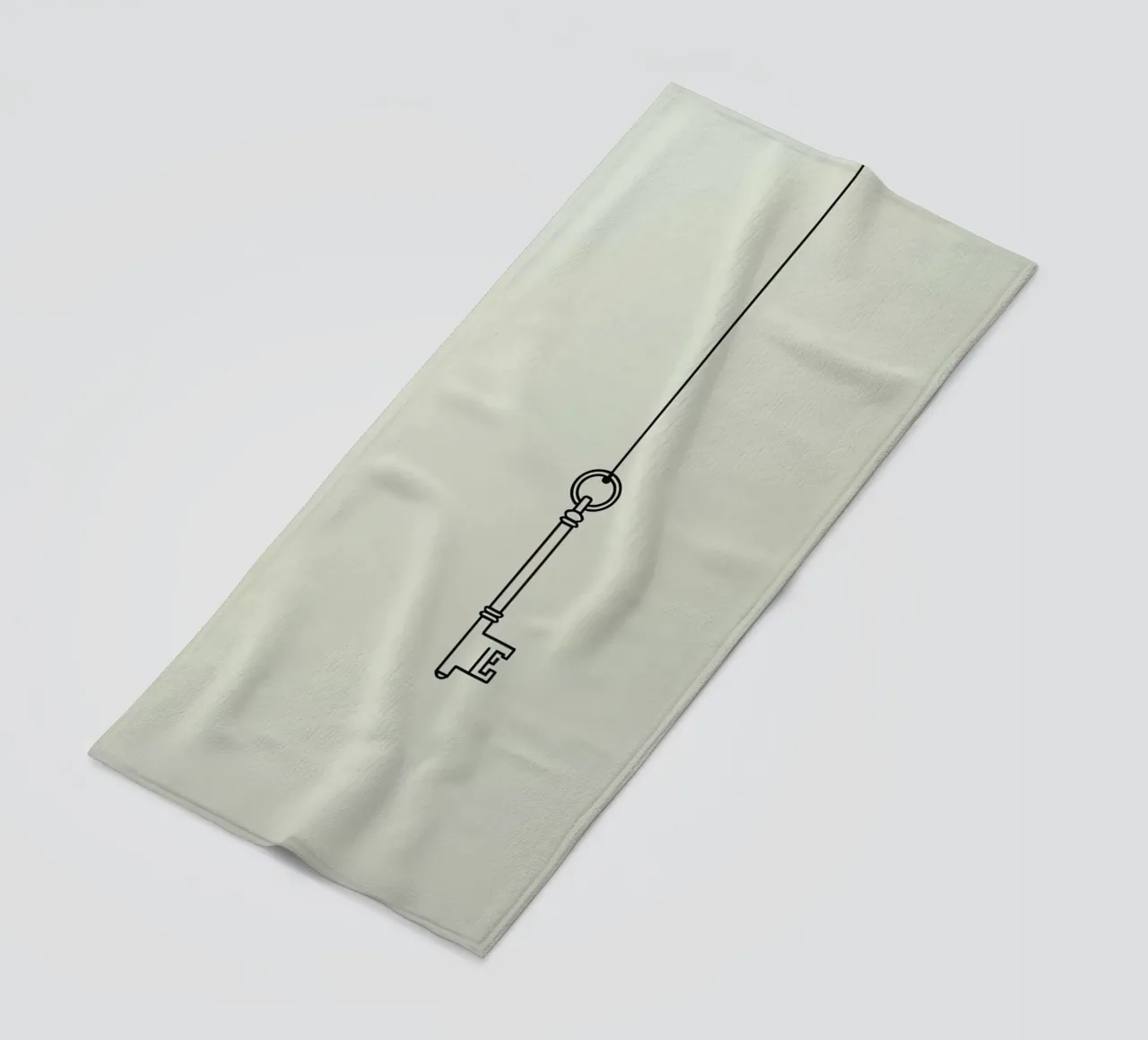 Key hanging from a string against a light backdrop beach towel by DesignDoodle