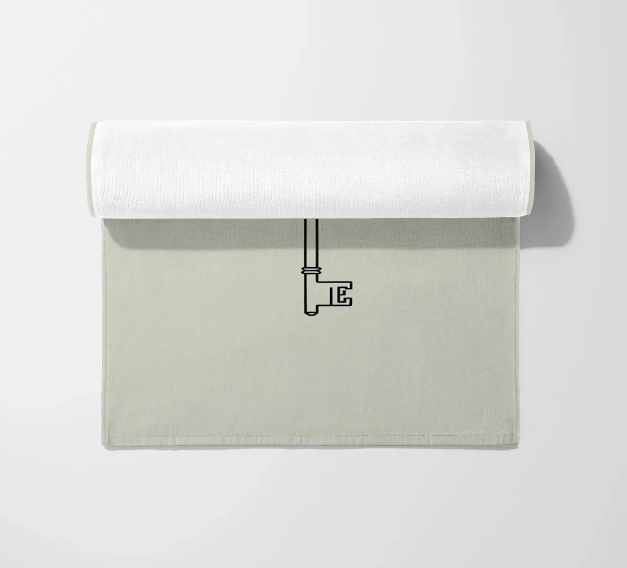 Key hanging from a string against a light backdrop beach towel by DesignDoodle