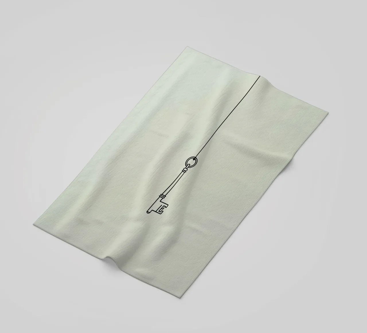 Key hanging from a string against a light backdrop beach towel by DesignDoodle
