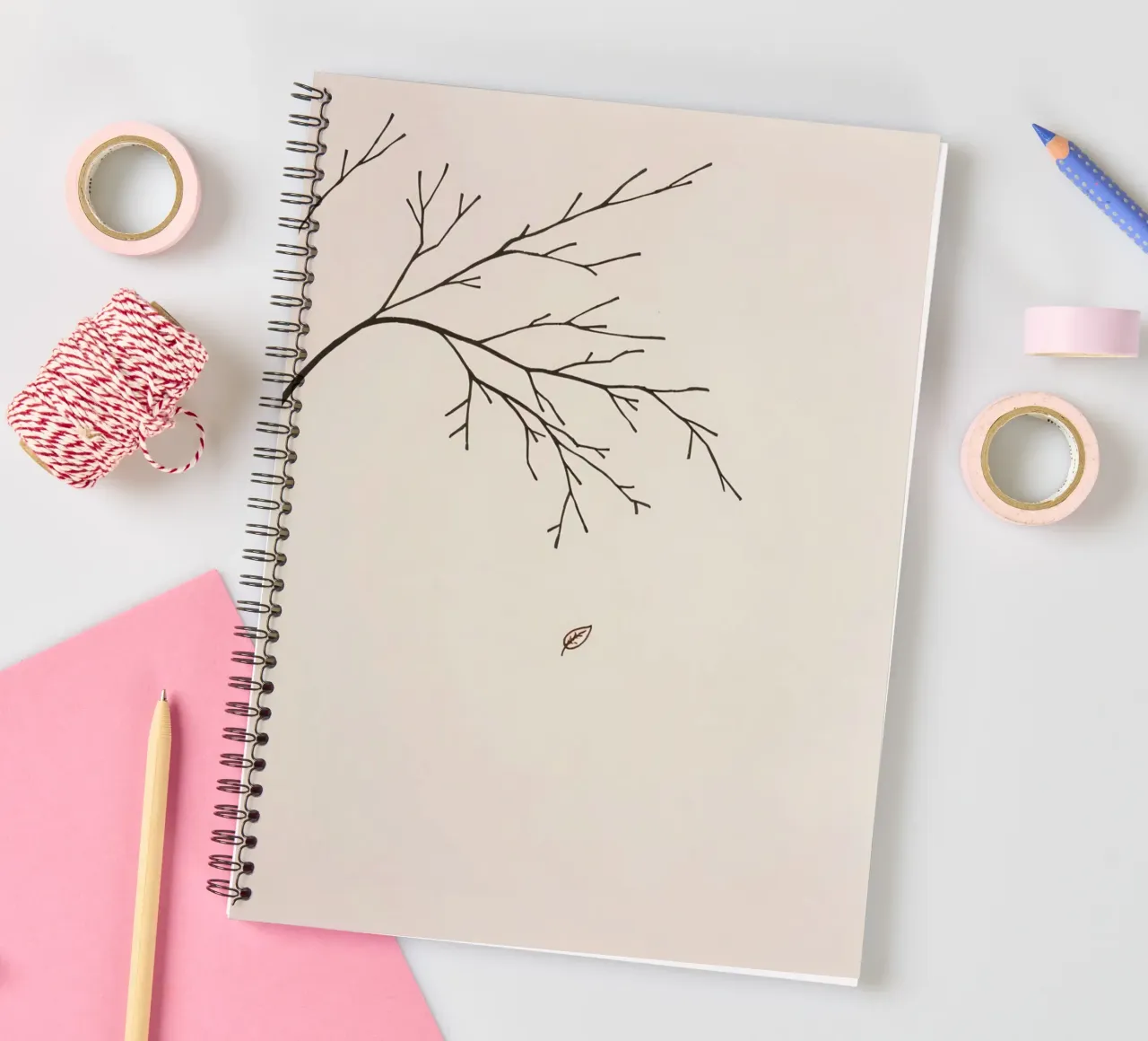 Stylized tree branch with a single leaf falling line art spiral notebook by DesignDoodle