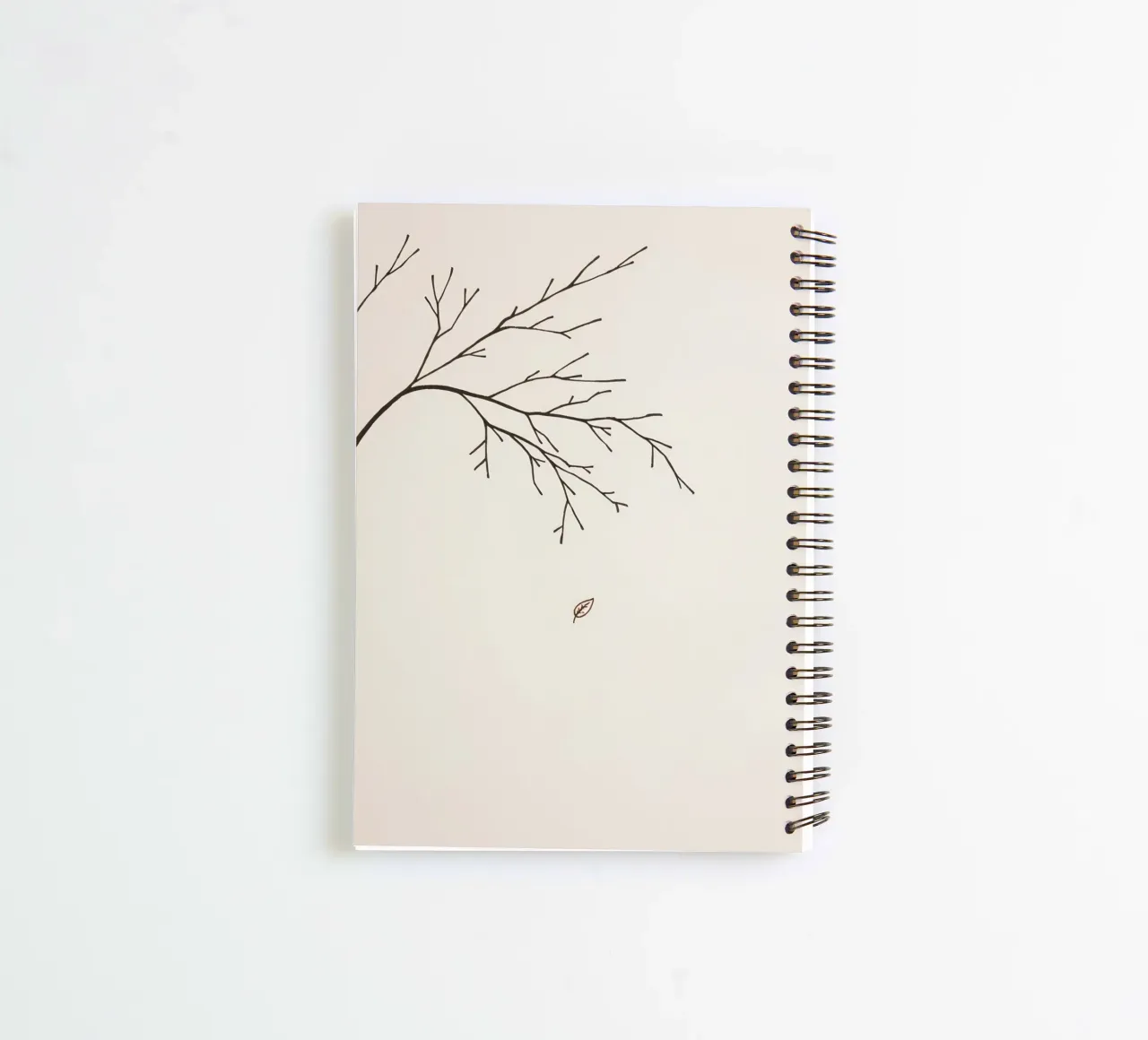 Stylized tree branch with a single leaf falling line art spiral notebook by DesignDoodle