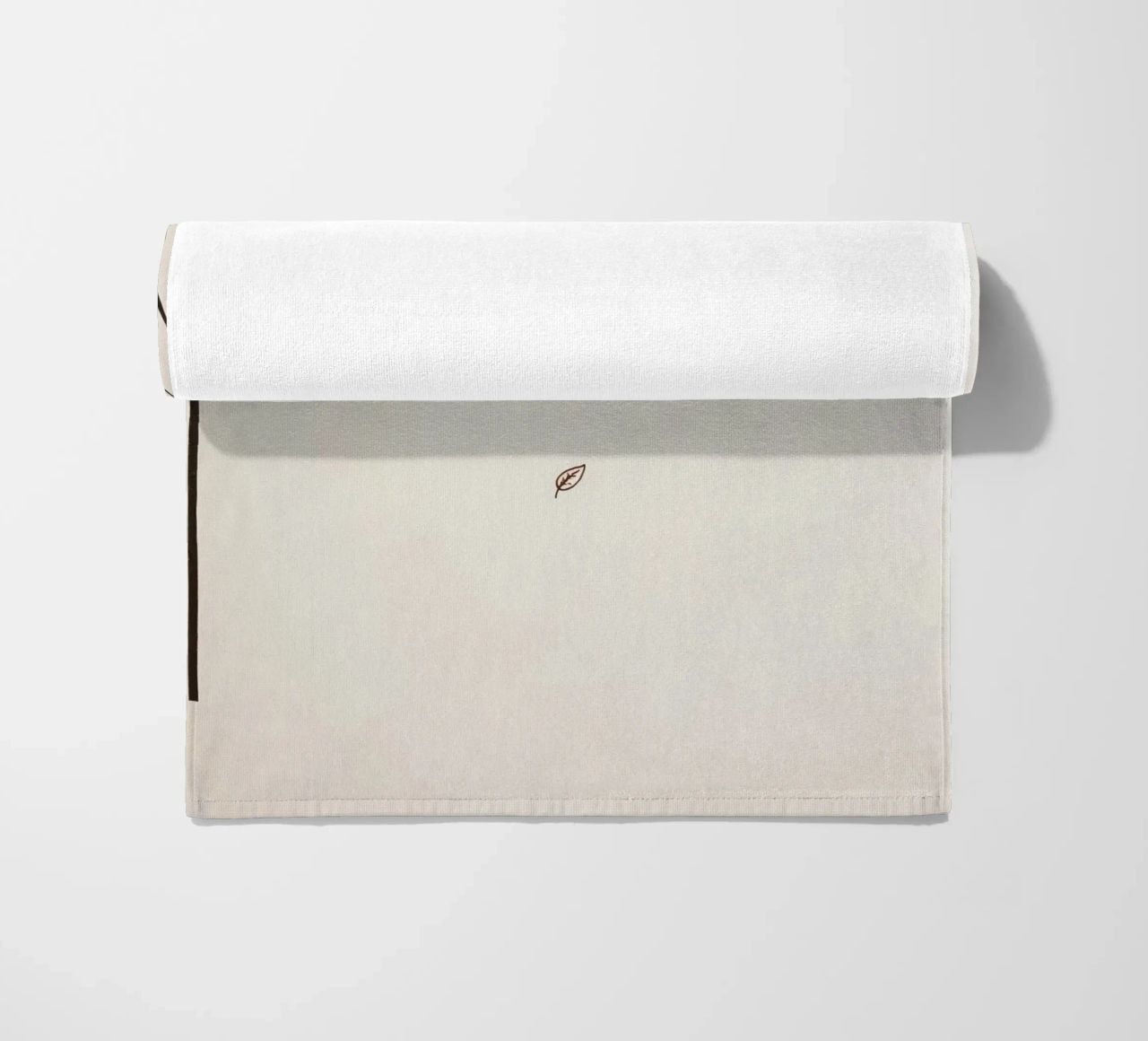 Stylized tree branch with a single leaf falling line art beach towel by DesignDoodle