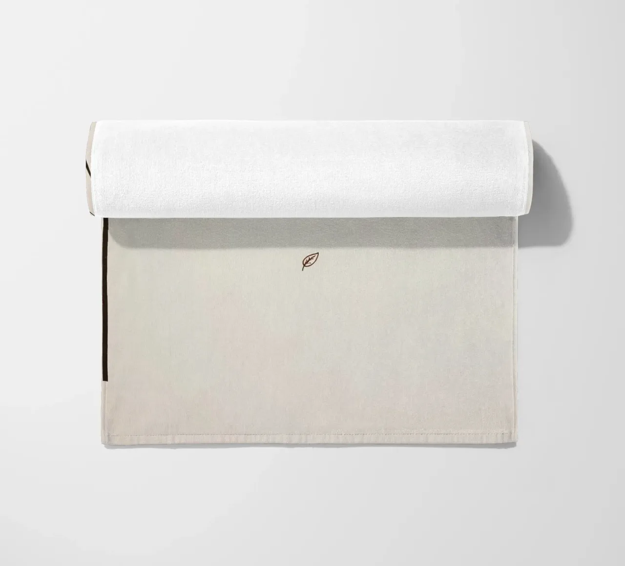 Stylized tree branch with a single leaf falling line art beach towel by DesignDoodle