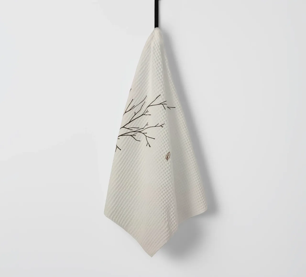 Branche d'arbre stylisée avec une seule feuille qui tombe dessin au trait torchon de DesignDoodle