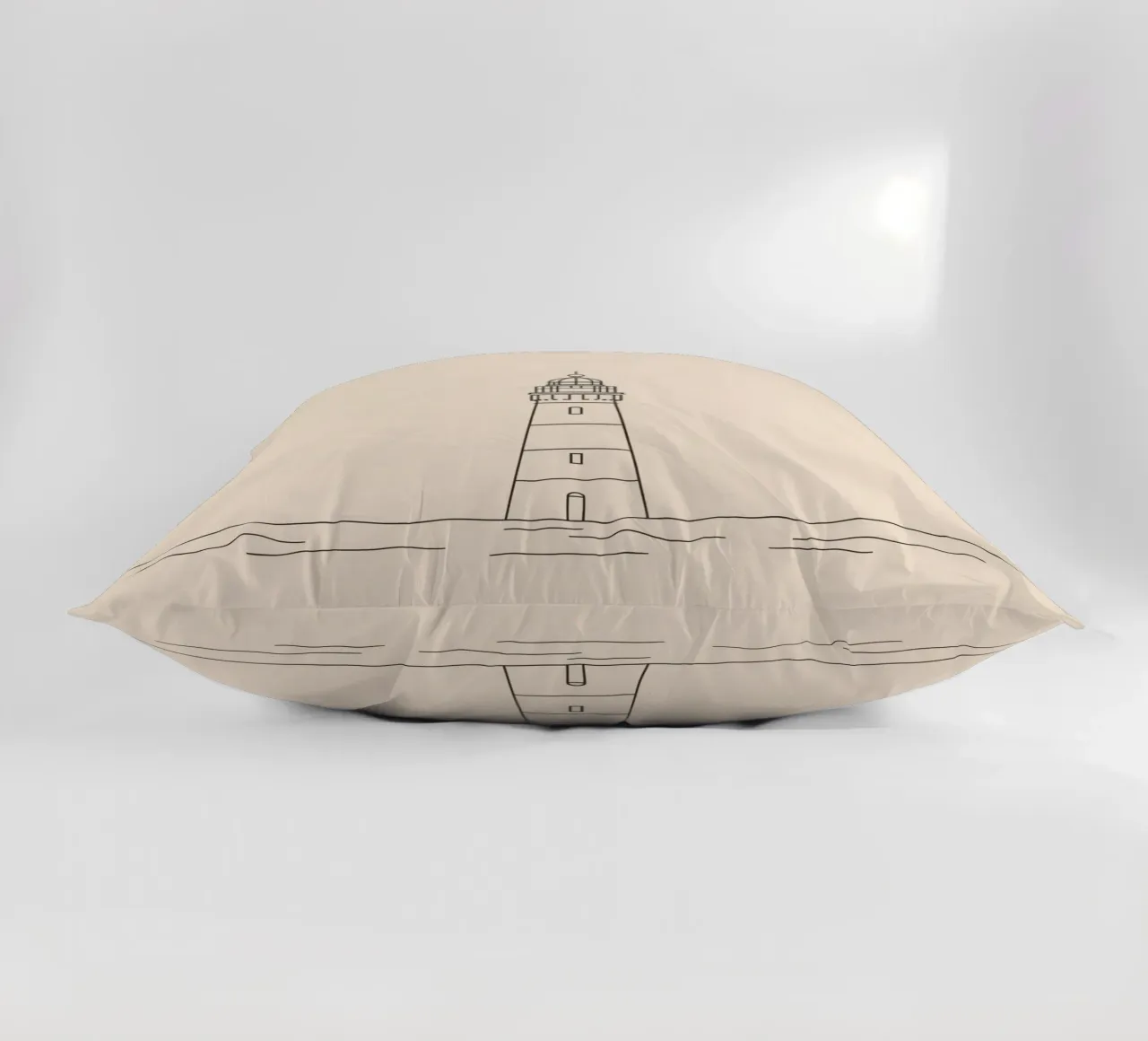 Lighthouse standing tall above gentle waves with a clear sky decorative cushion by DesignDoodle