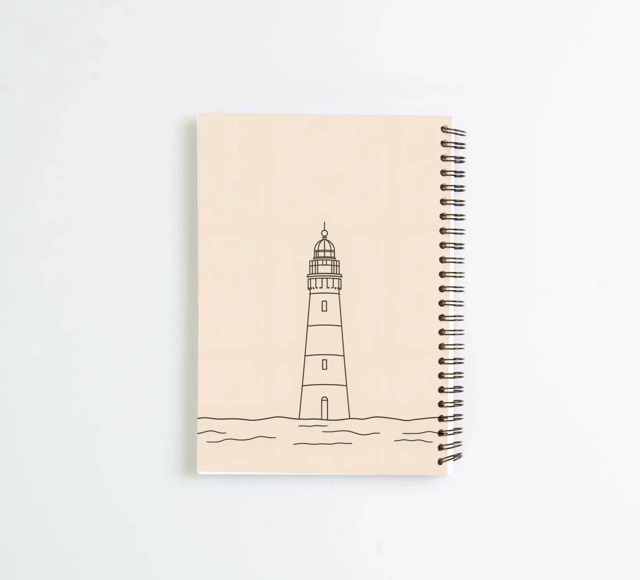 Lighthouse standing tall above gentle waves with a clear sky spiral notebook by DesignDoodle