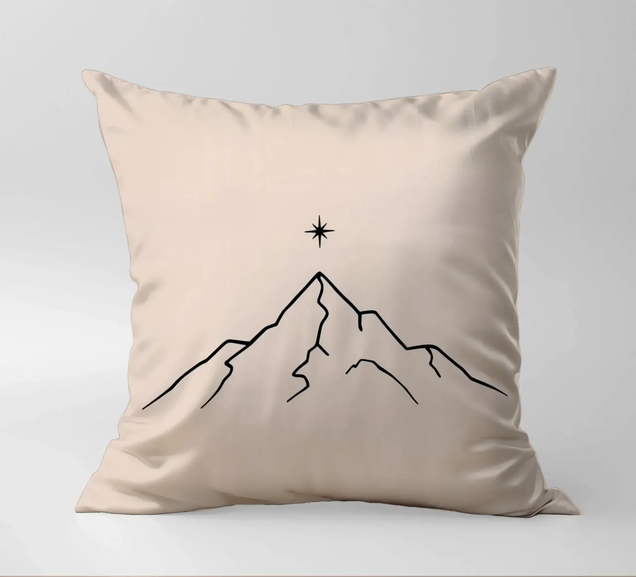 Mountain peak with a star above in a minimalist design decorative cushion by DesignDoodle