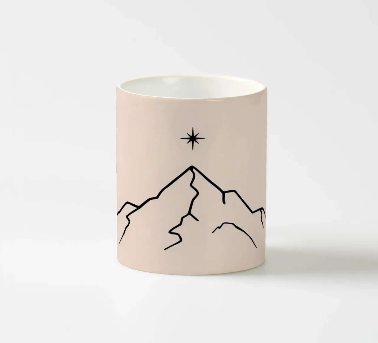 Mountain peak with a star above in a minimalist design ceramic mug by DesignDoodle