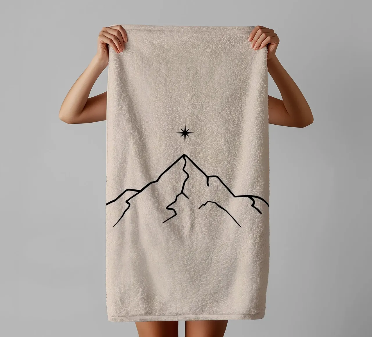 Mountain peak with a star above in a minimalist design towel by DesignDoodle