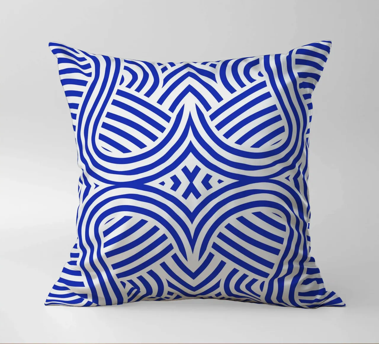 Symmetrical ultramarine and white pattern decorative cushion by Little Dean